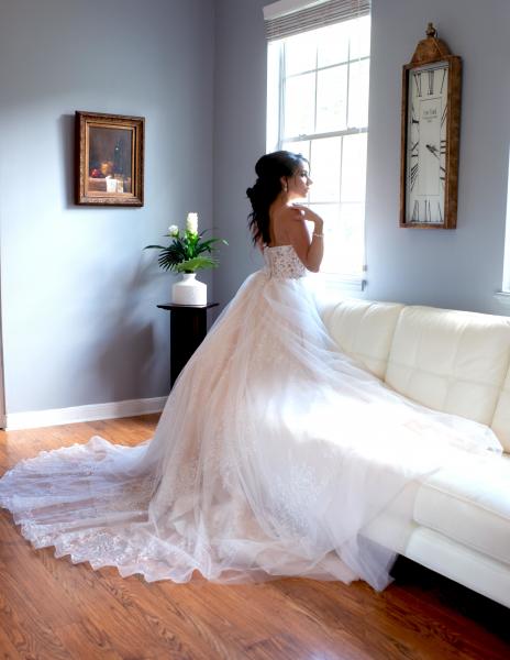 Bride in the light of sitting room.
